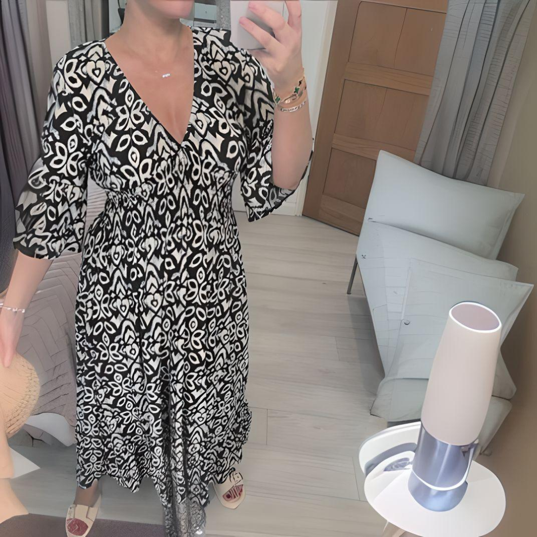 Vestito lungo boho per donna, design casual e ampio con scollo a V e fantasia grafica estiva.