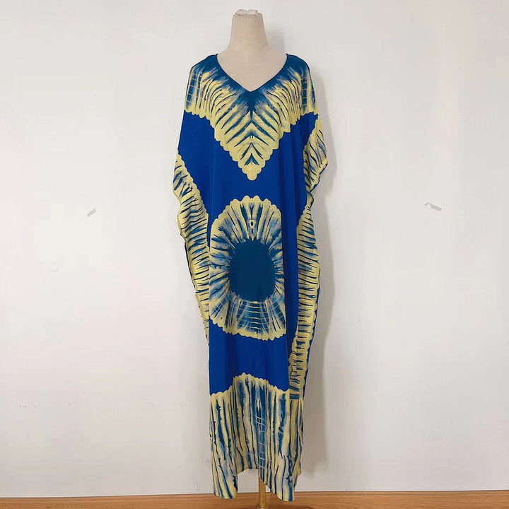 Abito da donna leggero con stampa fantasia, scollo a V, ideale per il comfort estivo.