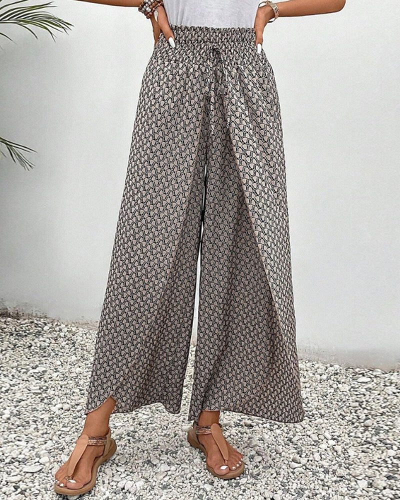 Pantaloni larghi da donna con elegante stampa geometrica, perfetti per look casual chic.