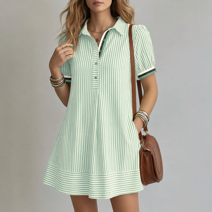 Chemisier a righe da donna, maniche a sbuffo. Un abito versatile che unisce moda femminile e look chic.