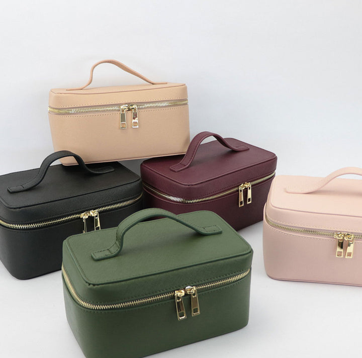 Vera pelle per beauty case da viaggio elegante, custodia portatile per cosmetici e igiene.