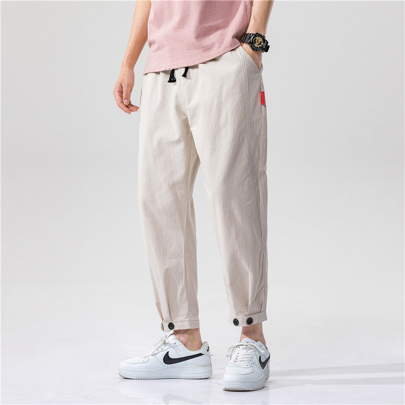 Pantaloni uomo streetwear beige con coulisse, vita elasticizzata e gamba affusolata. Ideali per comfort e stile casual.