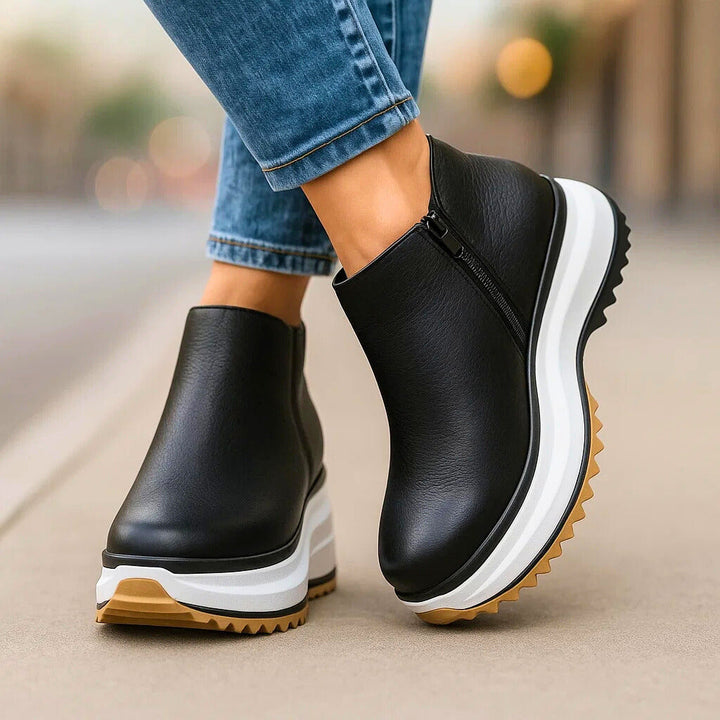 Moderne scarpe platform donna color bronzo, stivaletti con zip laterale, design casual e comodo.