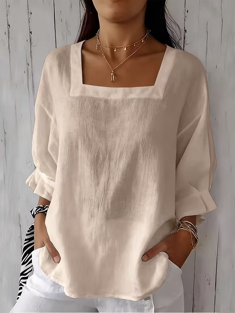 Blusa donna casual chic con scollo quadrato. Maniche fluide, ideale per l'estate, un tocco di eleganza quotidiana.