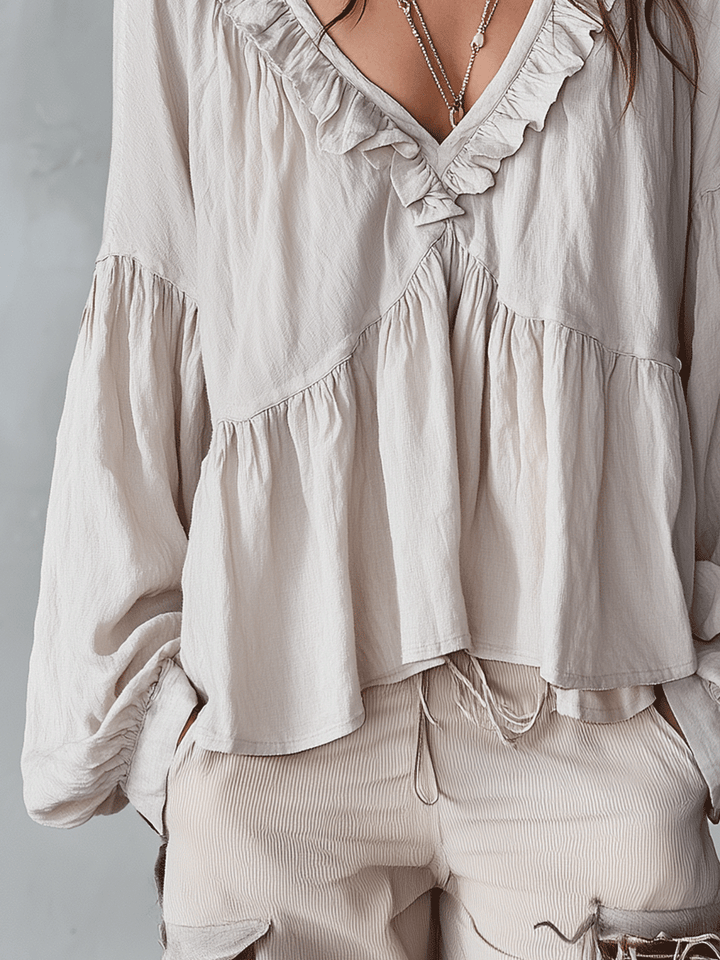 Top donna con volant, stile vintage e bohémien, ideale per moda femminile casual.