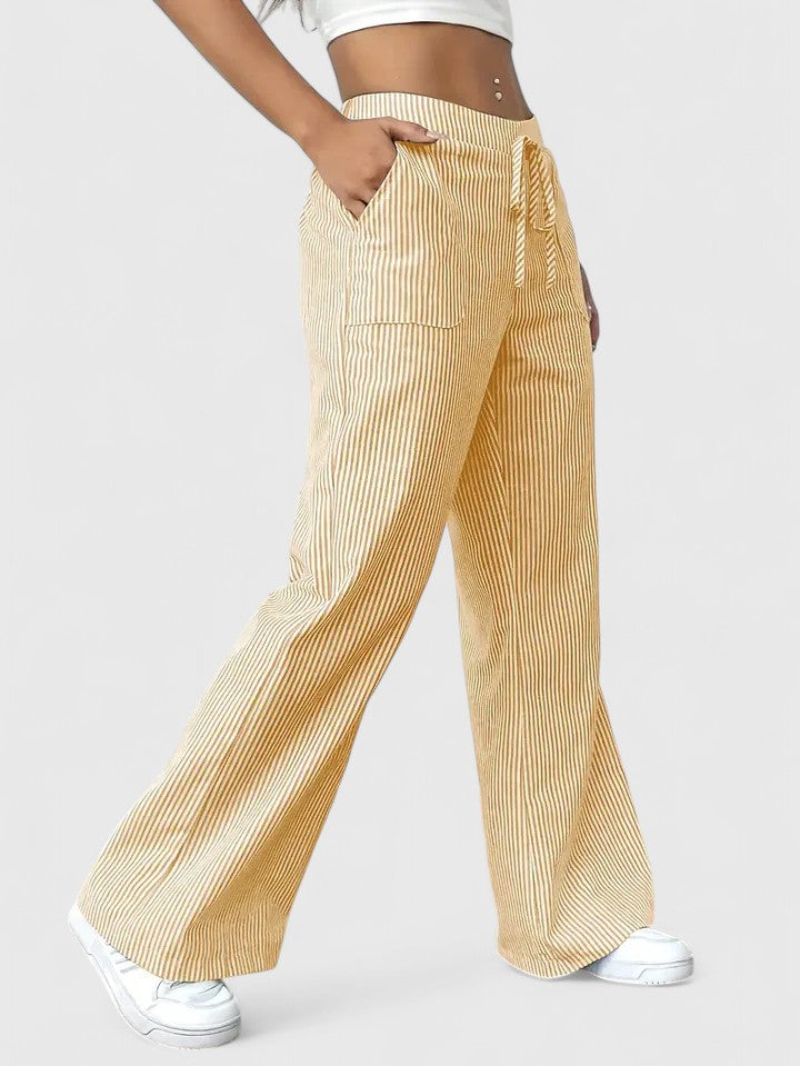 Pantaloni donna comodi e fluidi, vita alta regolabile con laccio. Ideali per outfit estivi versatili.