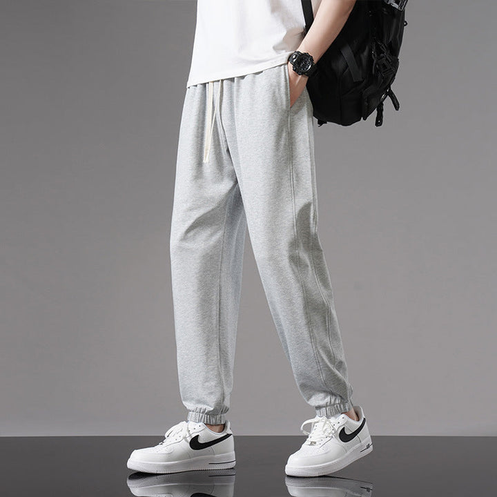 Pantaloni alla caviglia da uomo con coulisse, vestibilità ampia per moda estiva casual e comfort quotidiano.