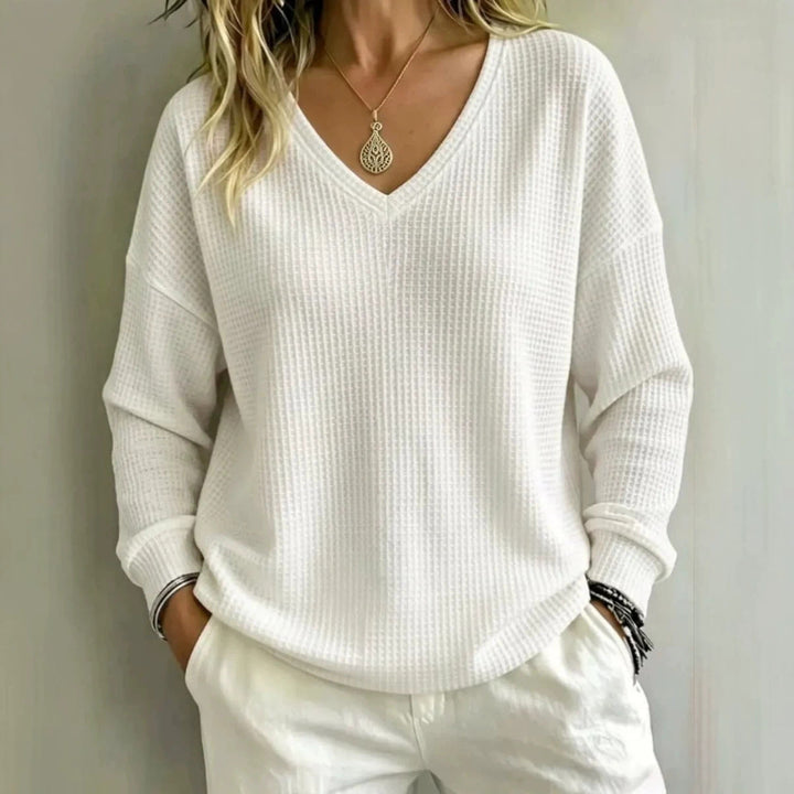 Maglione donna casual scollo a V, ideale per comfort quotidiano e vestibilità rilassata.
