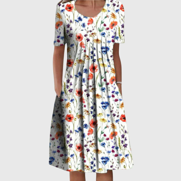 Abito midi floreale da donna con gonna svasata, perfetto per look casual o eleganti primavera/estate.