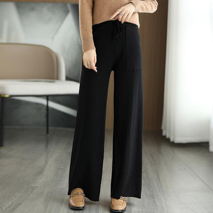 Silhouette ampia e confortevole: pantaloni donna vita alta e gamba larga, must-have per abbigliamento versatile.