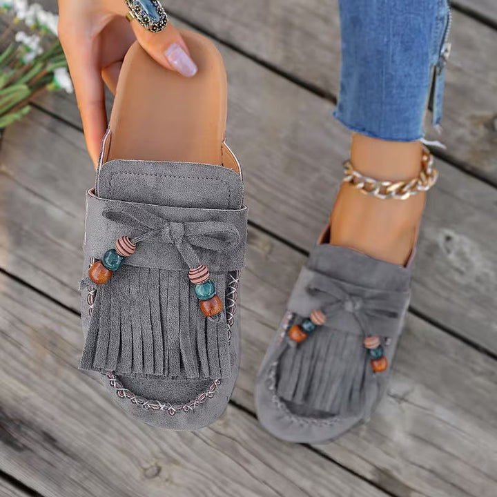 Moda estiva: sandali donna boho con nappe, perfetti per un look casual e confortevole.