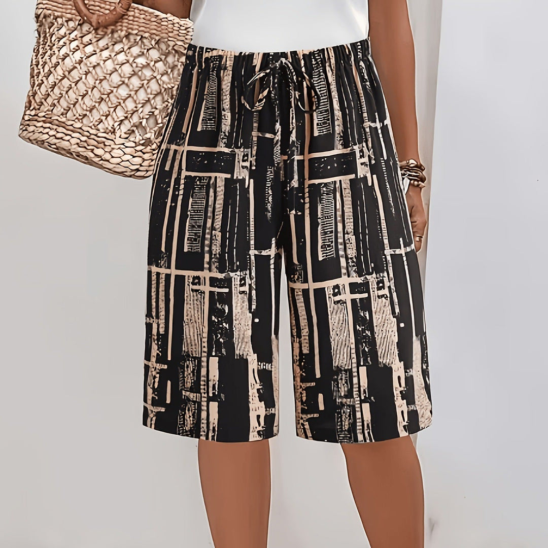 Pantaloni Capri uomo rilassati con coulisse regolabile e stampa unica. Ideali per un look casual estivo.