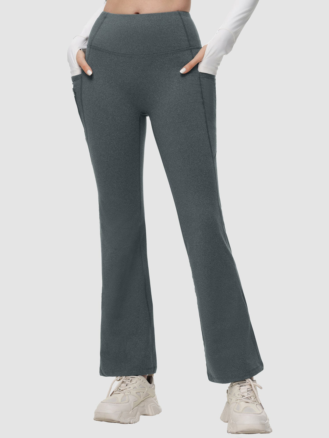 Pantaloni yoga donna a vita alta svasati, termici, con tasche laterali per il tuo comfort.