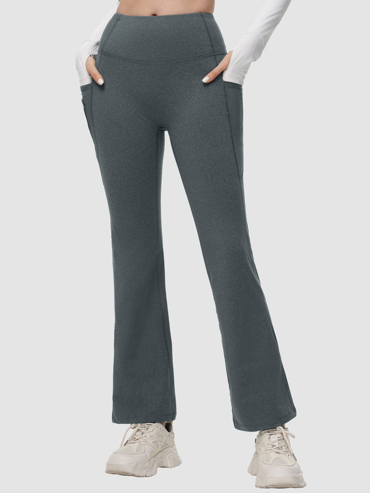 Pantaloni yoga donna a vita alta svasati, termici, con tasche laterali per il tuo comfort.
