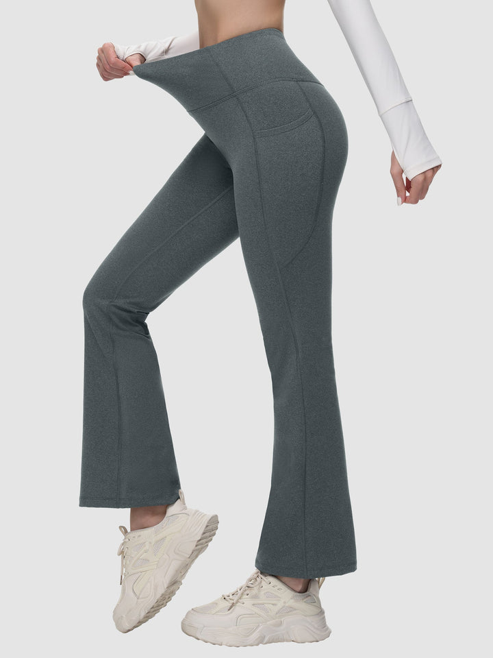 Pantaloni yoga donna a vita alta, svasati, termici, con tasche, per massimo comfort.