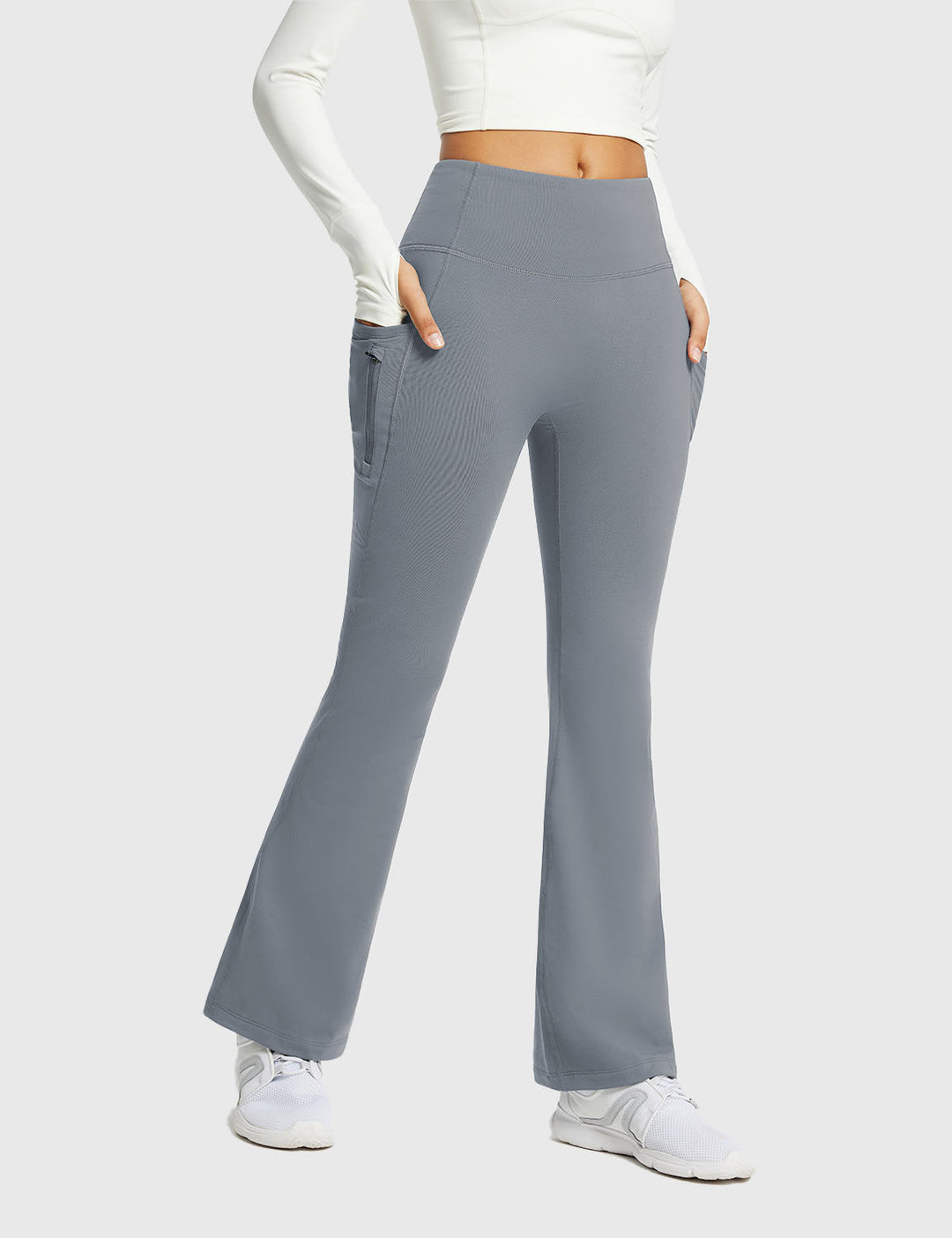Pantaloni yoga donna svasati a vita alta, termici, con tasche, per un comfort extra.