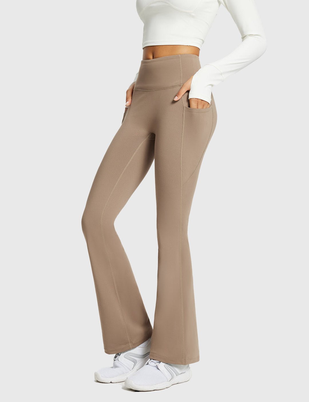 Pantaloni sportivi termici donna, a vita alta, svasati, con tasche, per outdoor invernale.