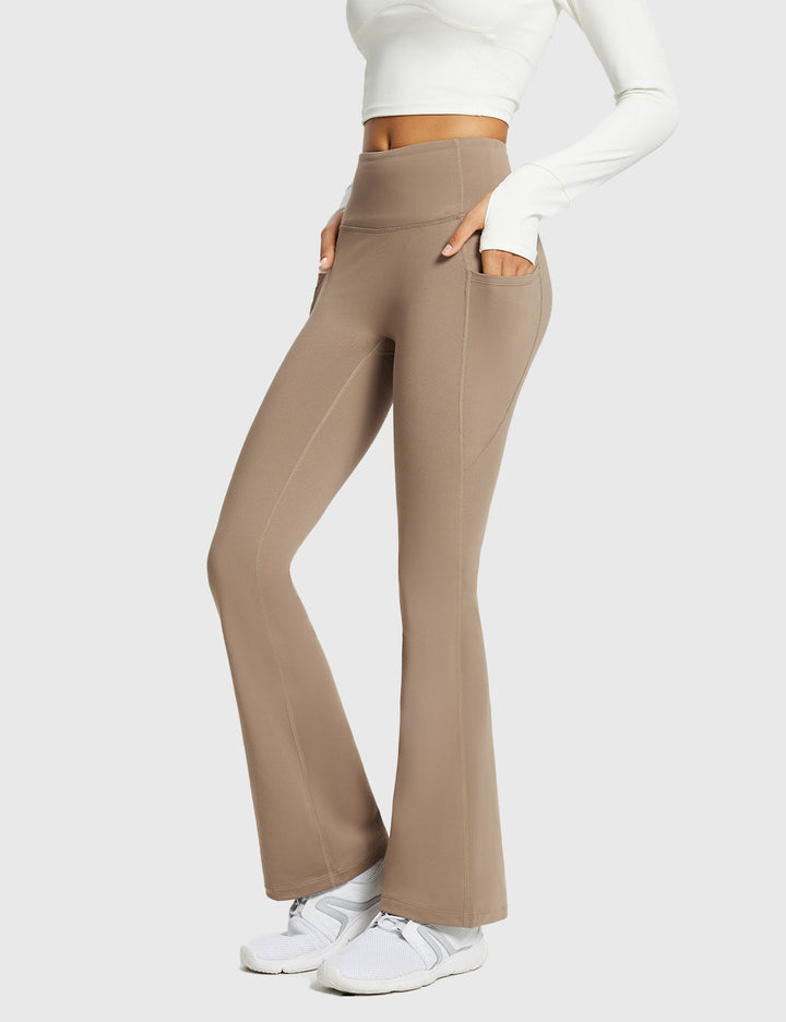 Pantaloni sportivi termici donna, a vita alta, svasati, con tasche, per outdoor invernale.