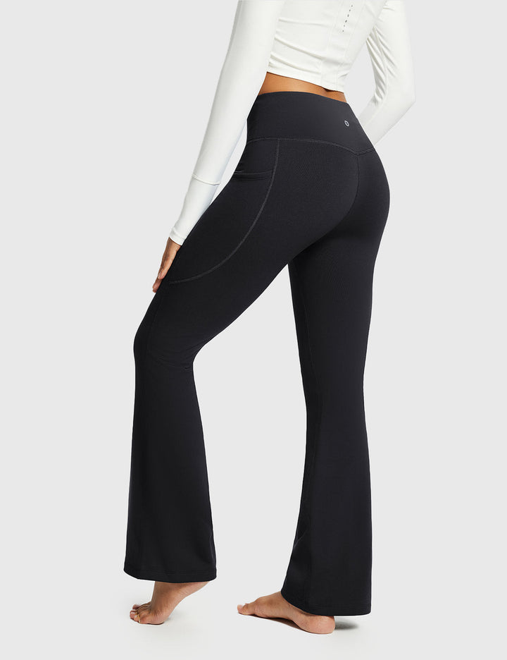 Pantaloni donna a vita alta svasati, termici, ideali per inverno e sport outdoor.