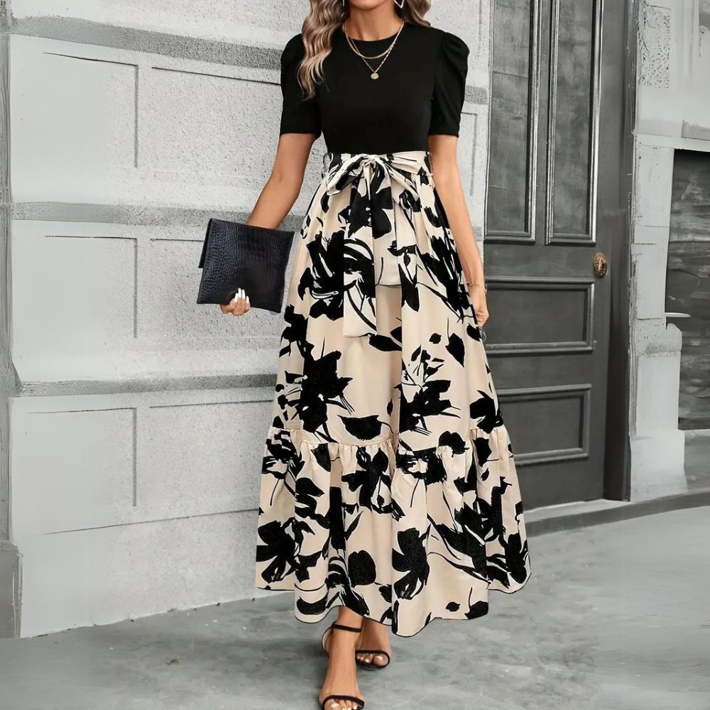Abito lungo estivo donna con stampa floreale colorata, vita alta e linea A, perfetto per eleganza casual da giorno.