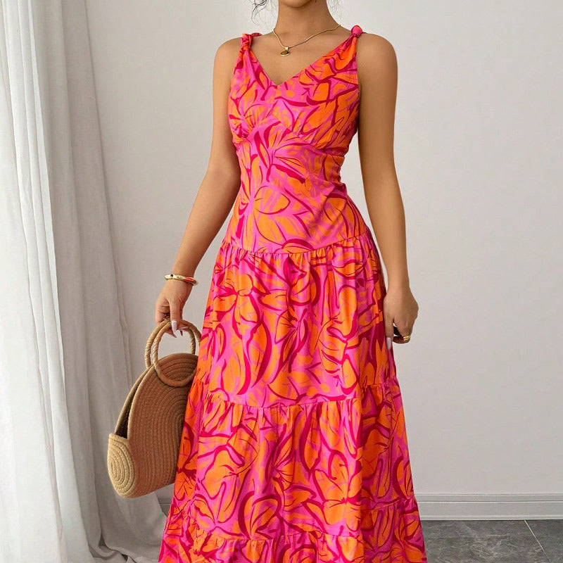 Vestito estivo donna senza maniche con fantasia tropicale. Abito lungo comodo per vacanze, spiaggia o look casual.