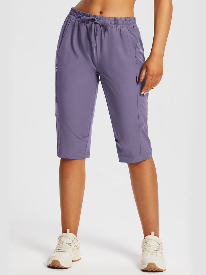 Pantaloni capri donna per fitness intenso, con tasche ergonomiche e supporto muscolare.