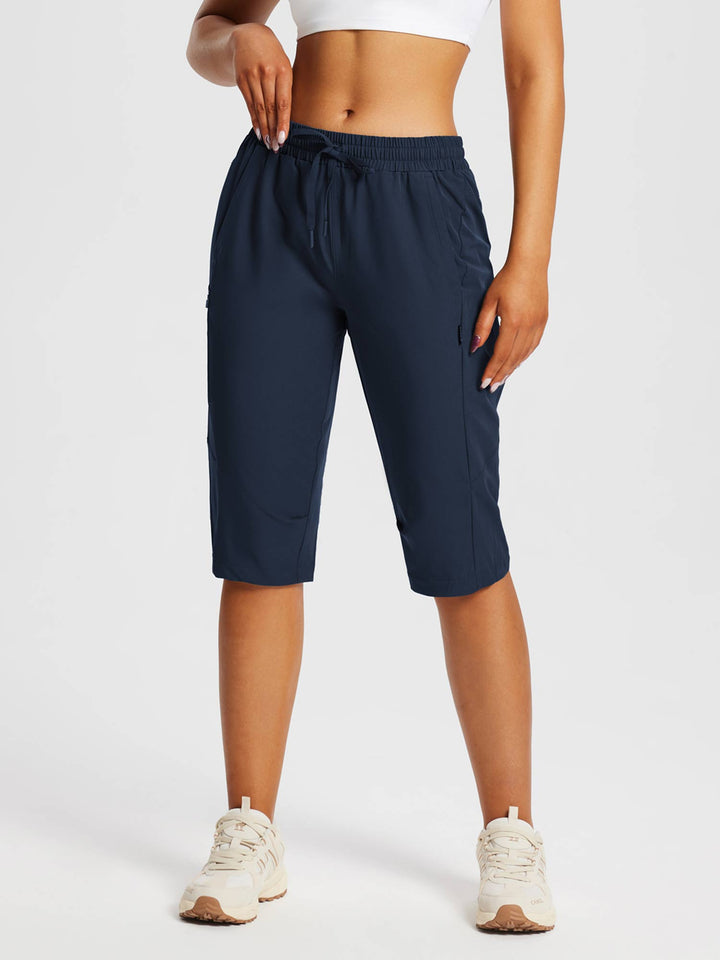 Capri sportivi donna con tasche, perfetti per lunghe passeggiate e sport estivi.