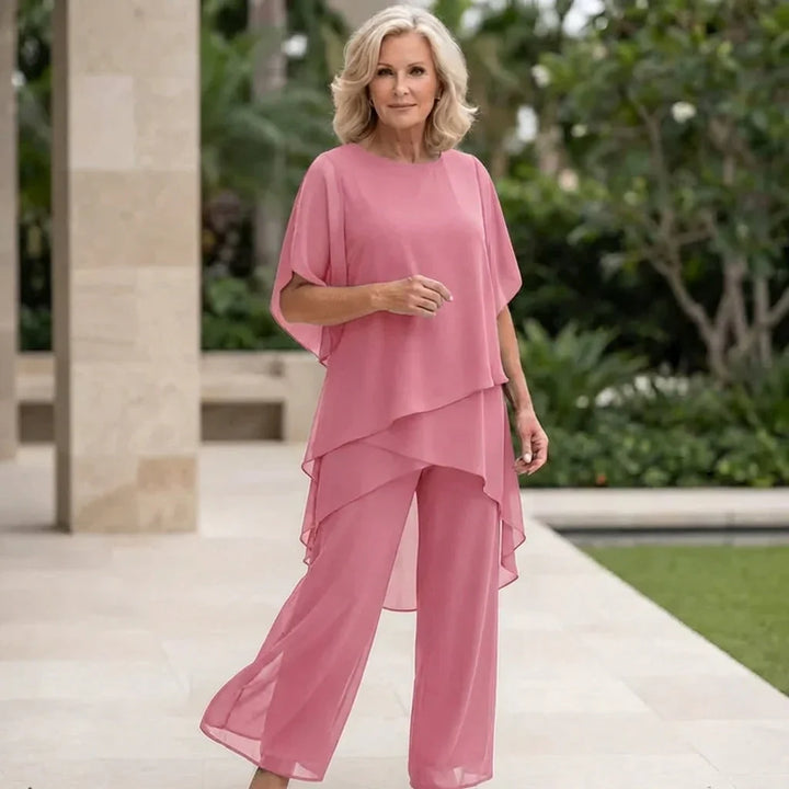Set donna con top drappeggiato e pantaloni palazzo a gamba larga, vestibilità fluida per massimo comfort elegante.