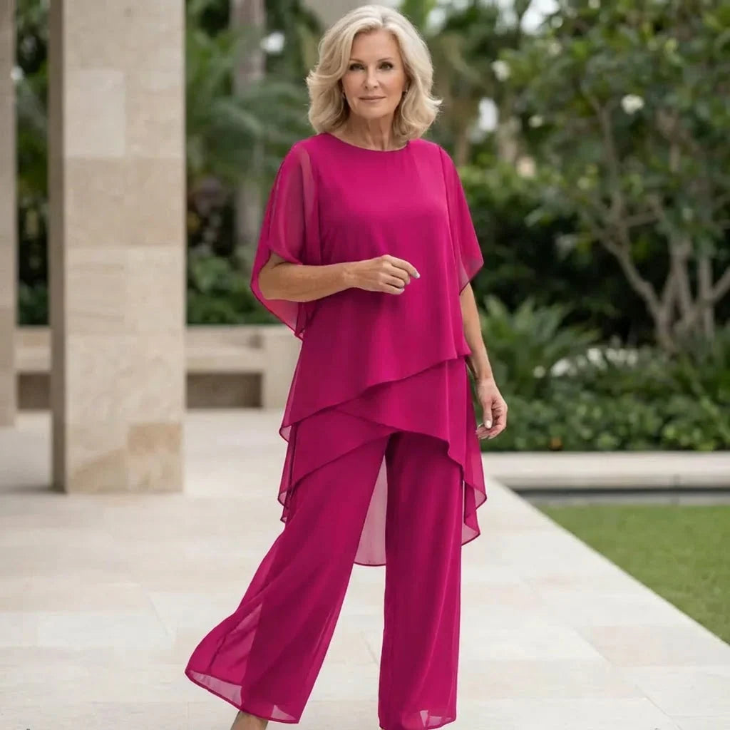 Completo donna drappeggiato, top elegante e pantaloni palazzo, ideale per abbigliamento formale e serale.