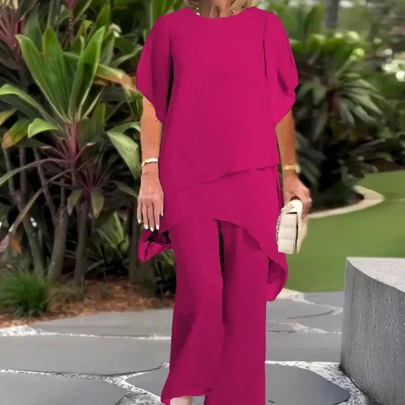 Completo due pezzi donna: top drappeggiato elegante e pantaloni palazzo, coordinato per ogni occasione.