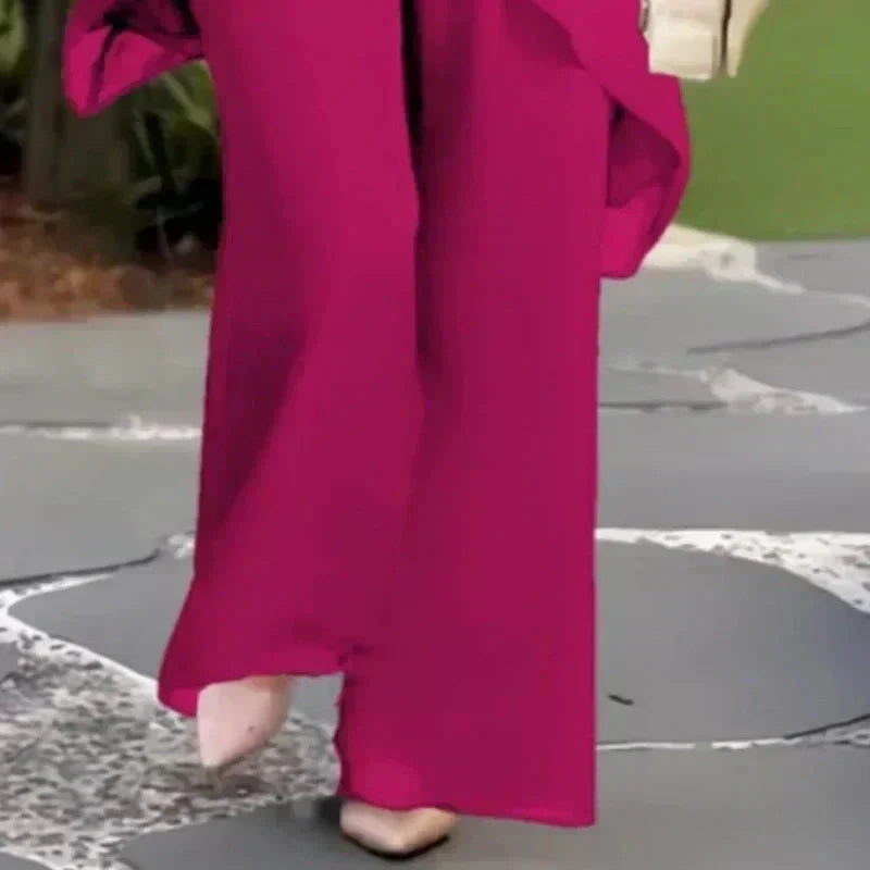 Eleganza raffinata con il completo coordinato donna: top drappeggiato e pantaloni palazzo. Perfetto per eventi.