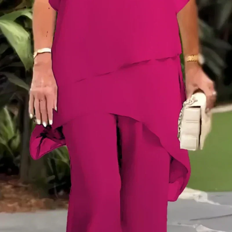 Completo drappeggiato donna con top e pantaloni palazzo, ideale per abito cerimonia o look serale. Stile fluido.