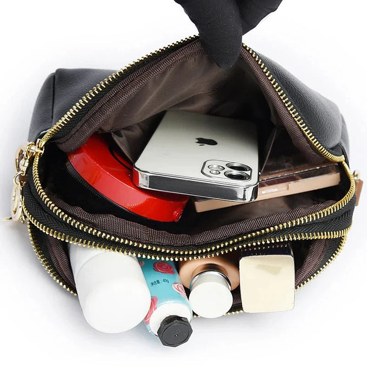 Borsa piccola a tracolla da donna in vera pelle. Design elegante, compatta e funzionale per l'uso quotidiano.