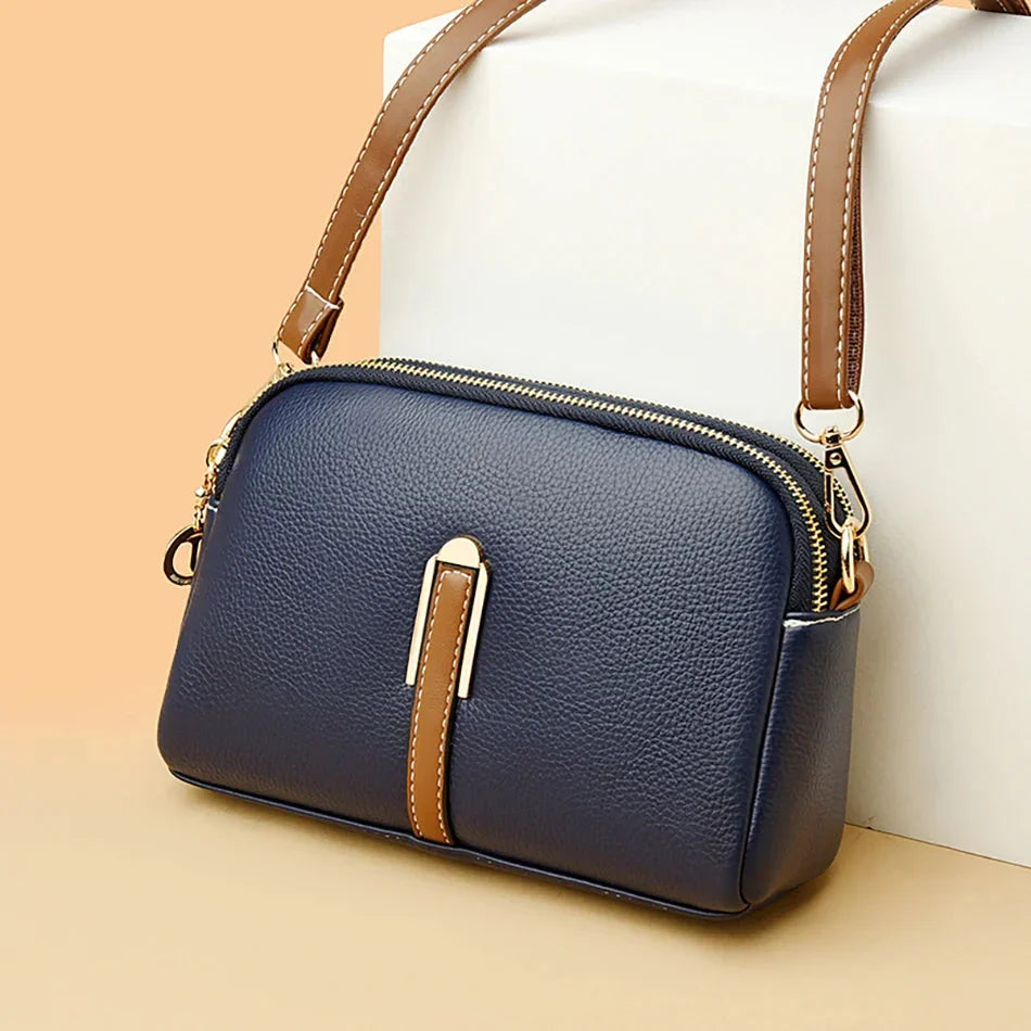 Borsa a tracolla nera da donna in vera pelle, design elegante e pratico. Perfetta per ogni outfit.