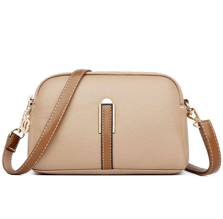 Borsa a tracolla in vera pelle da donna, disponibile nei colori nero, rosso e blu. Accessorio elegante e versatile.