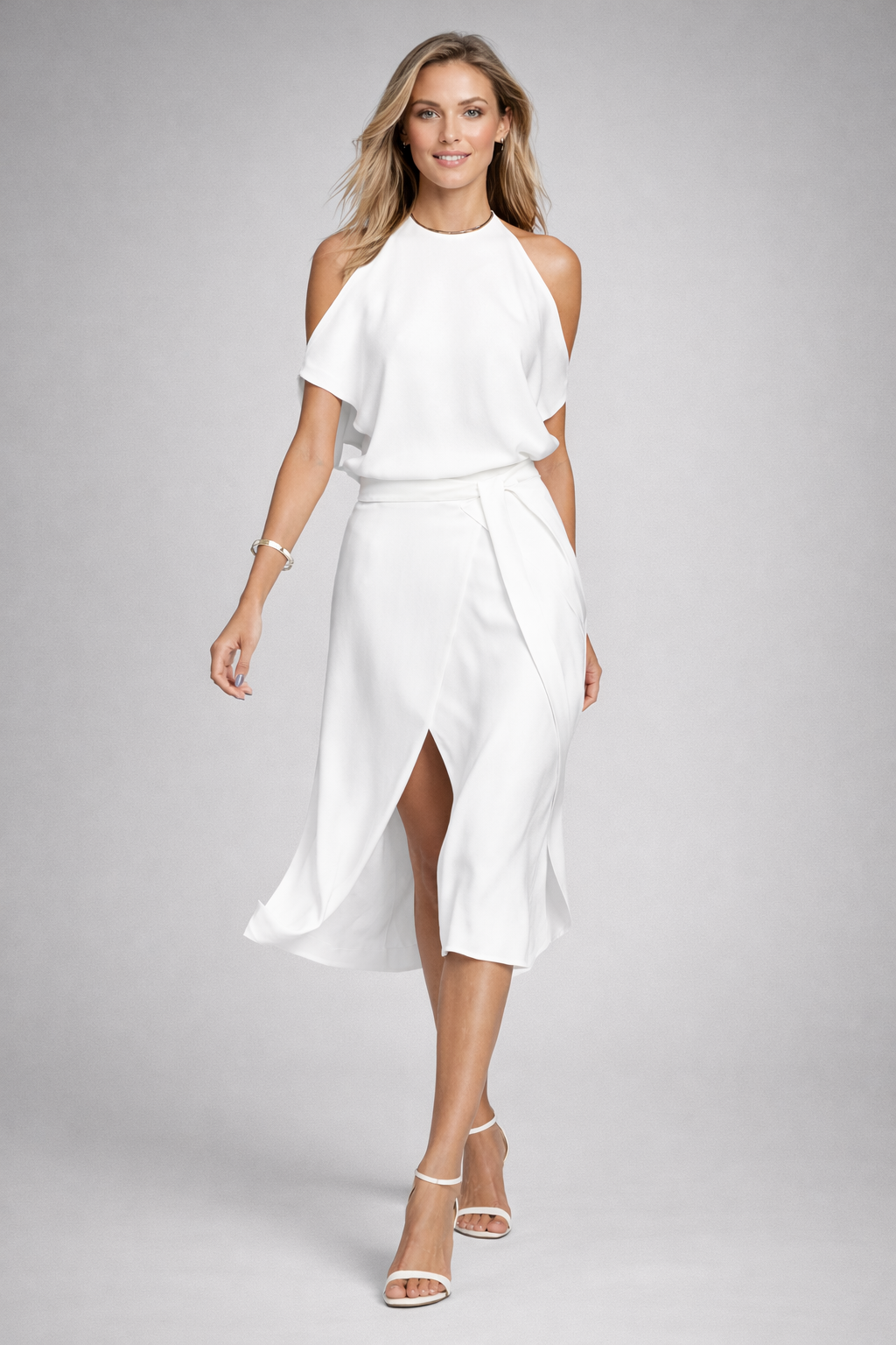 Abito midi donna chic con scollo off-shoulder e orlo irregolare. Perfetto per eventi speciali e look serali raffinati.