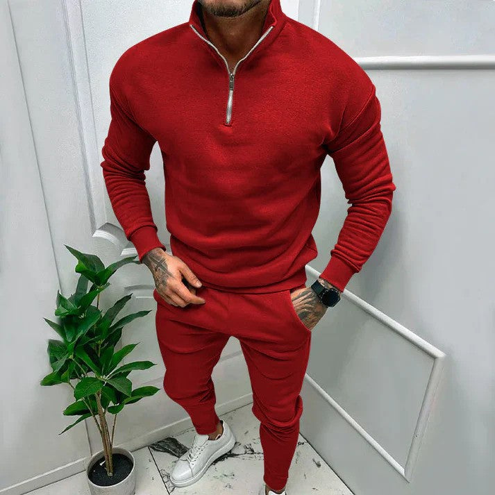 Tuta sportiva uomo dal design moderno, completo athleisure con felpa e pantaloni, stile casual per ogni giorno.