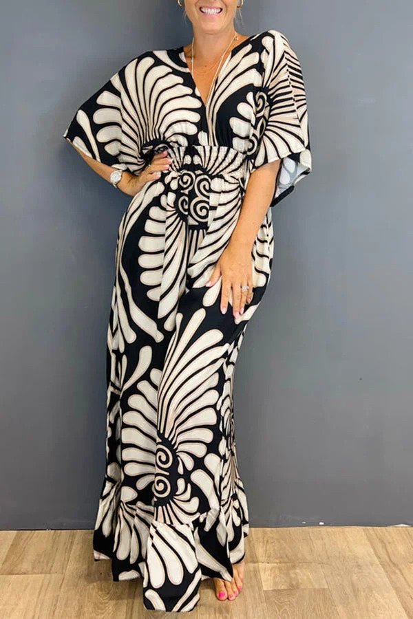 Elegante tuta floreale da donna vintage, gamba ampia e maniche arricciate. Outfit primaverile comodo e chic.