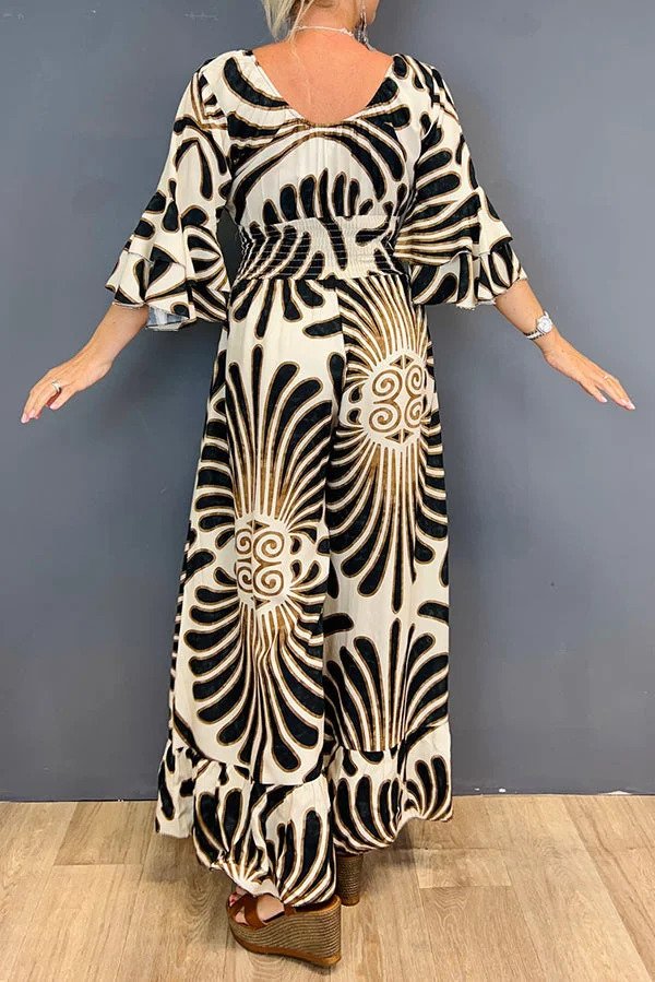 Tuta da donna floreale vintage a gamba larga, con delicate maniche arricciate. Abbigliamento moda donna elegante.