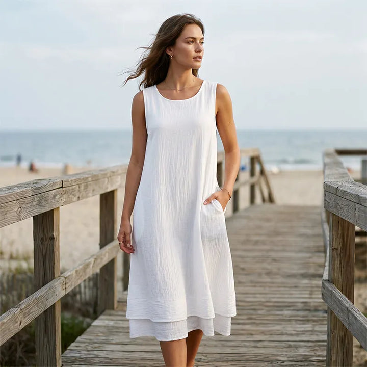 Abito midi smanicato donna, balza elegante, tessuto comodo in poliestere per versatilità quotidiana.