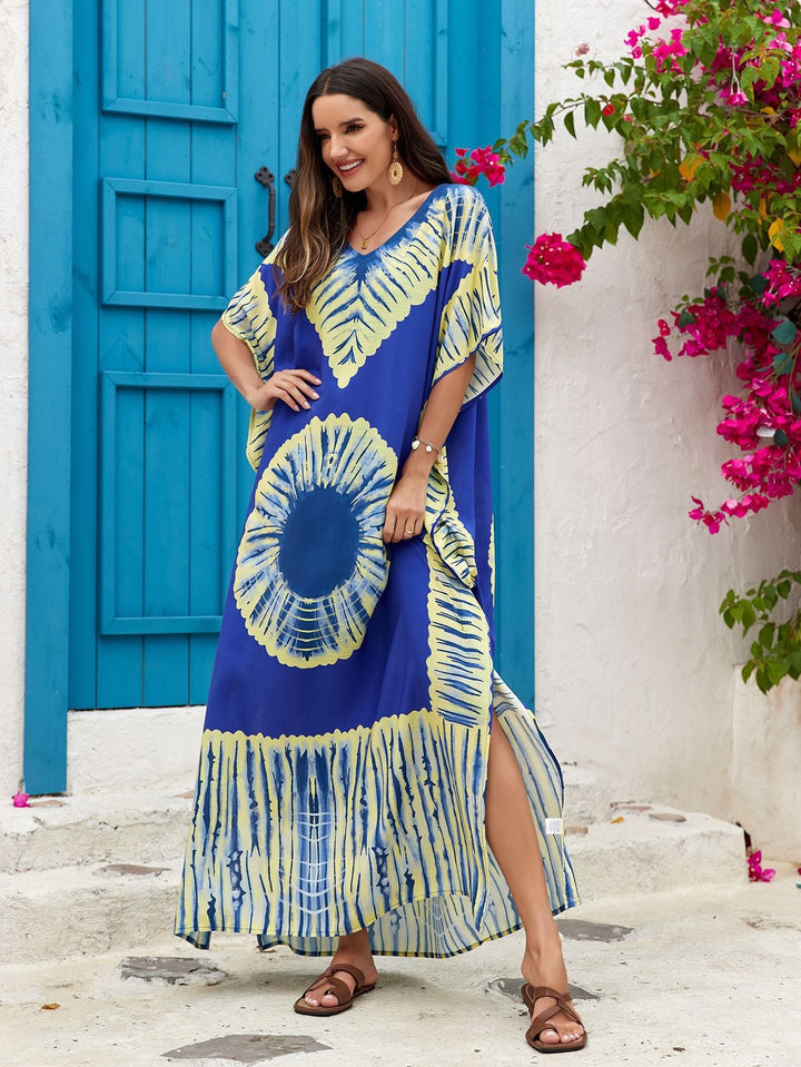 Abito lungo donna, stampa boho-chic, scollo a V profondo, tessuto leggero e traspirante.