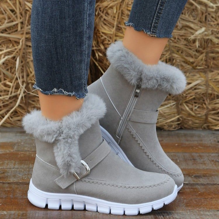 Eleganti stivaletti donna invernali con dettagli fibbia e pratica zip, ideali per un look casual-chic.