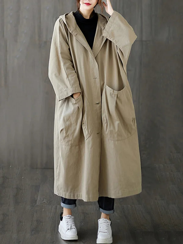 Trench impermeabile donna oversize, elegante e versatile per look casual o chic, con cappuccio.