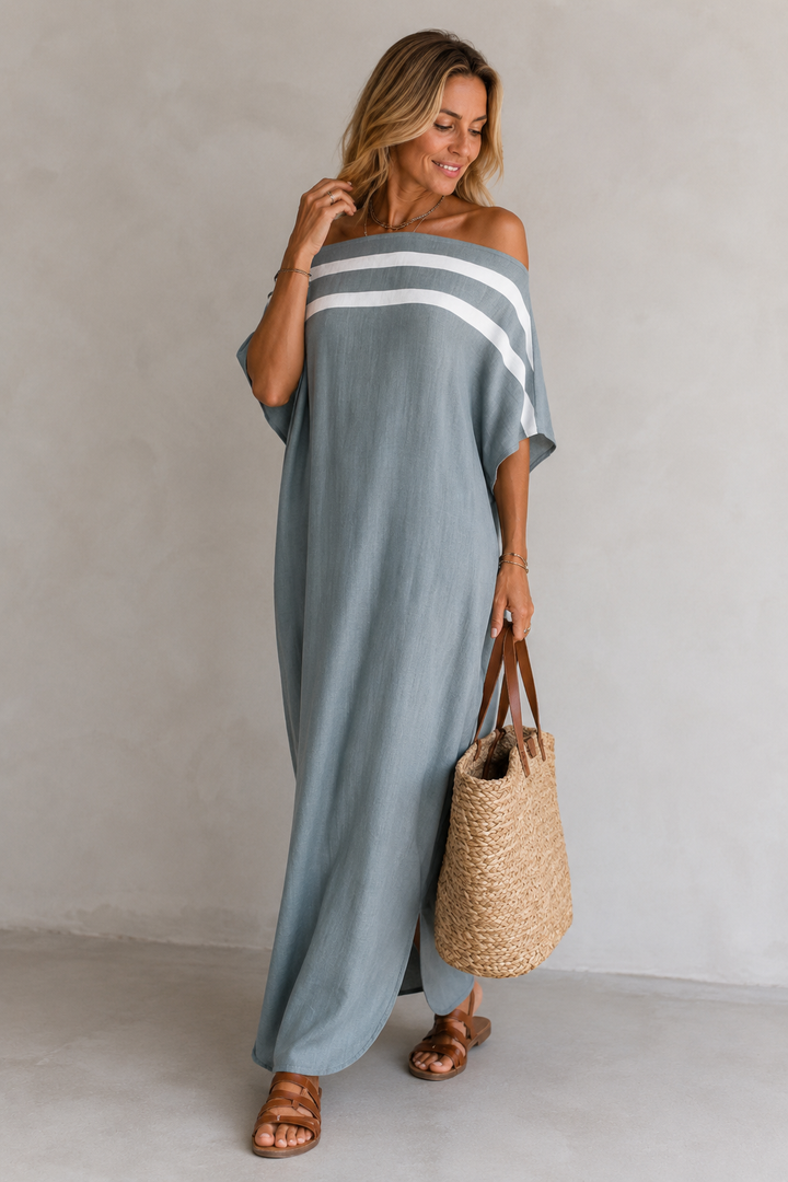Abito donna maxi fluido che esalta la silhouette, elegante e leggero. Perfetto per un look femminile estivo e chic.