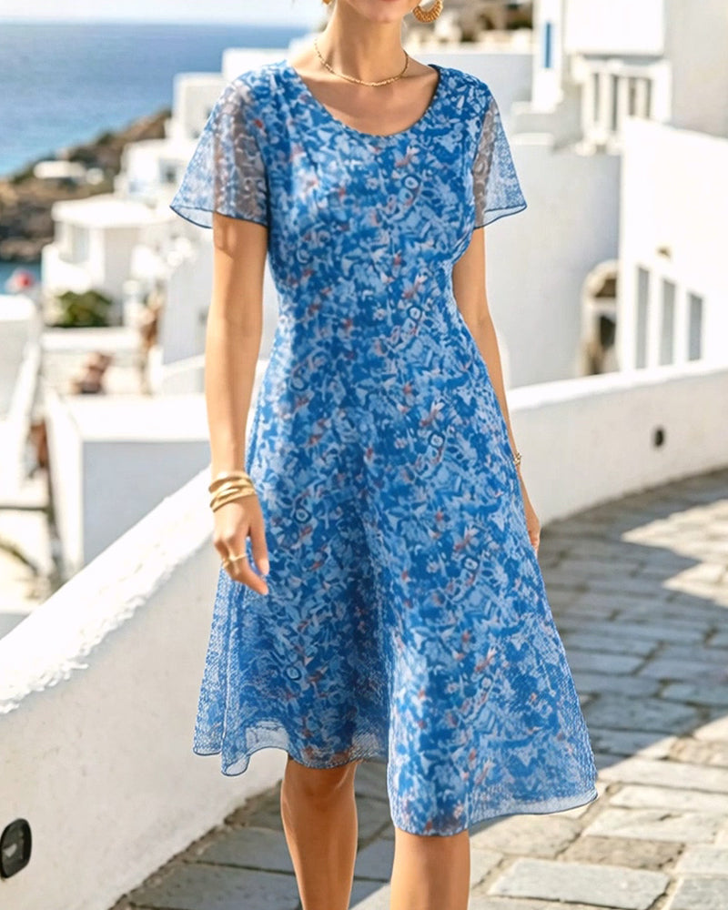 Vestito floreale A-line per donna, maniche corte, look fresco e casual estivo.