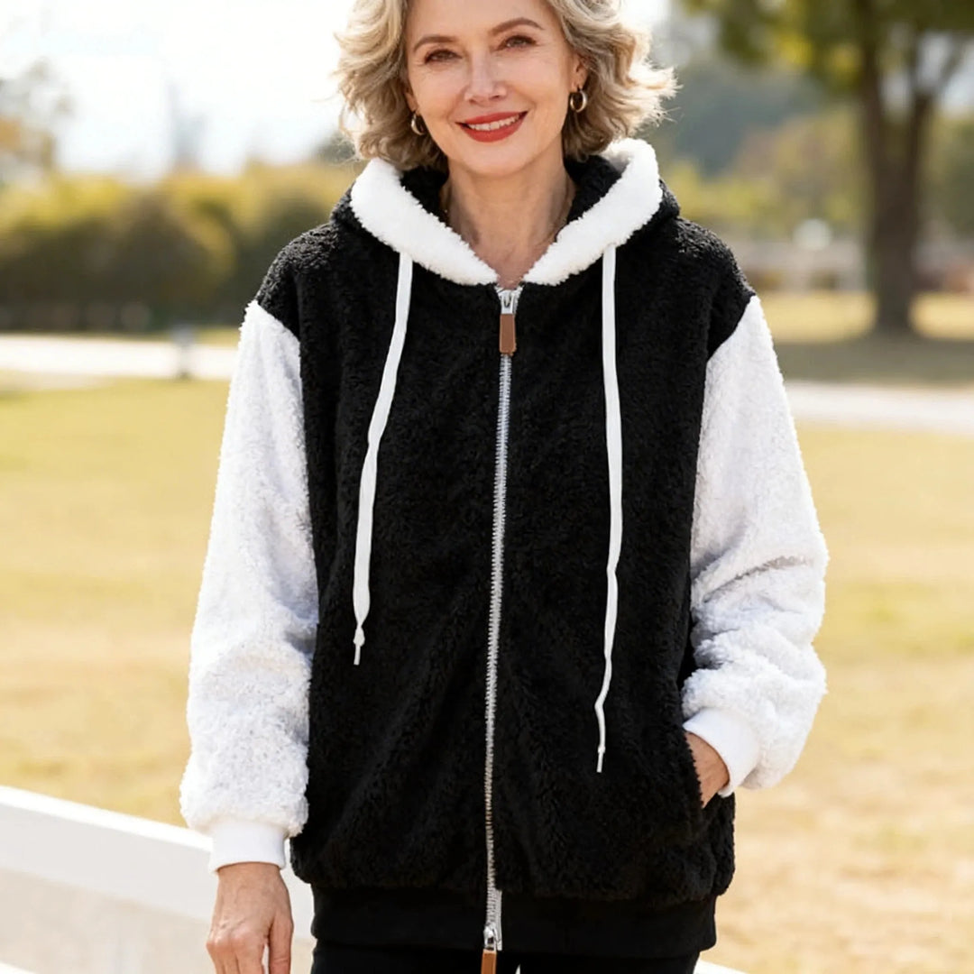 Giacca in pile donna ecologica con cappuccio e zip, calda e versatile per l'abbigliamento invernale.