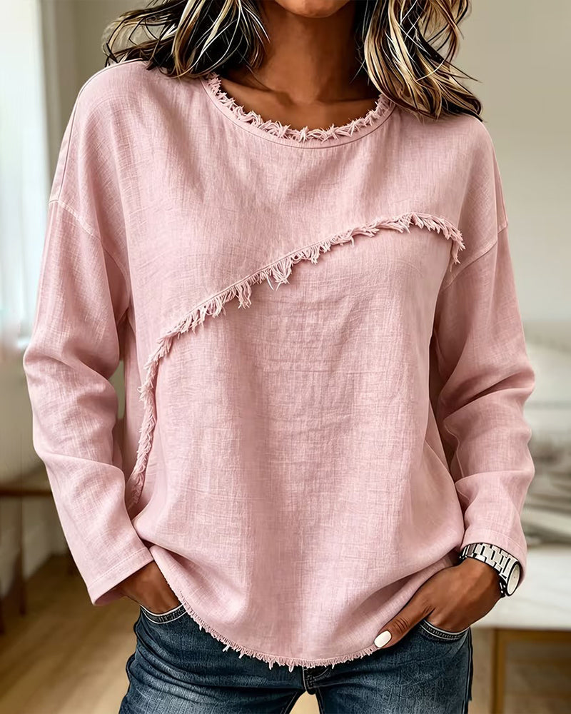 Blusa donna elegante asimmetrica rosa con frange, perfetta per un look moderno e casual-chic primavera/autunno.