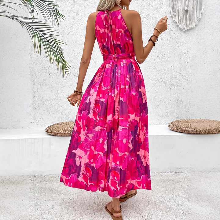 Elegante abito midi floreale per donna, con taglio senza maniche e vita plissettata, un must-have della moda estiva.