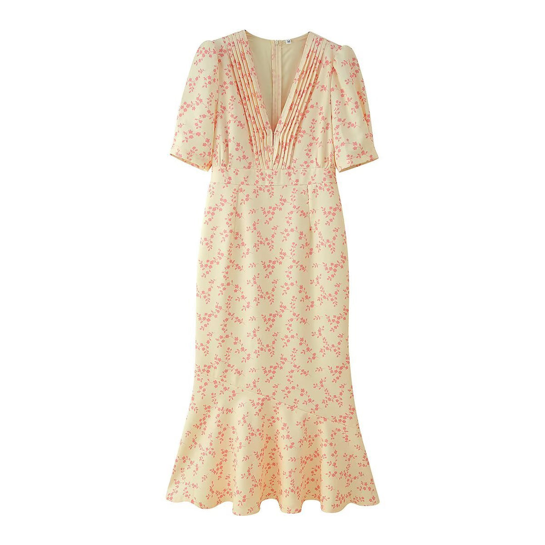 Vestito midi donna estivo a fantasia floreale con delicate maniche a palloncino, un must per la moda estiva.