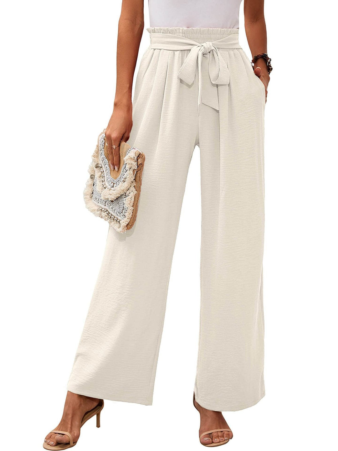 Pantaloni donna eleganti vita alta con nodo, gamba ampia. Perfetti per outfit casual e ufficio.